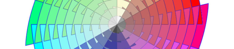 A color wheel visual with segments displaying a gradient range of colors from green to red, transitioning through blue and purple hues. The center is grey, surrounded by lighter shades.