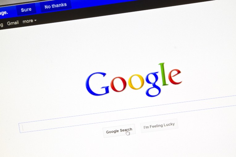 A computer screen displaying the Google search engine homepage with the cursor hovering over the "Google Search" button.