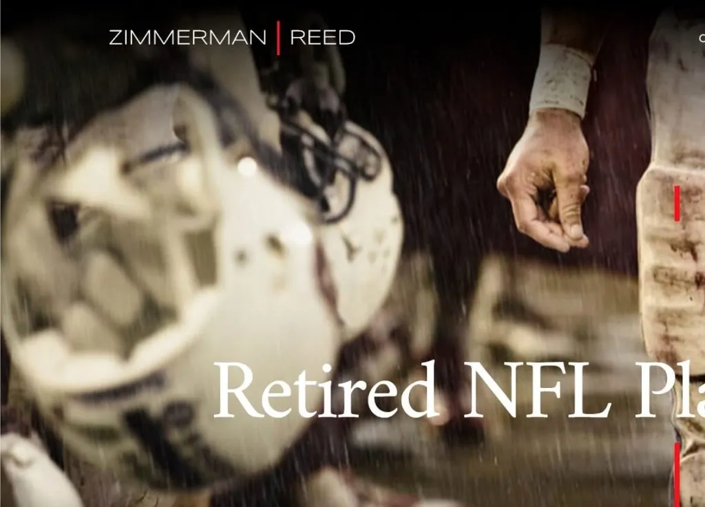 Close-up of a football player's hand and part of their uniform during a rainy game, with "Retired NFL Players" text and helmets hanging in the background.